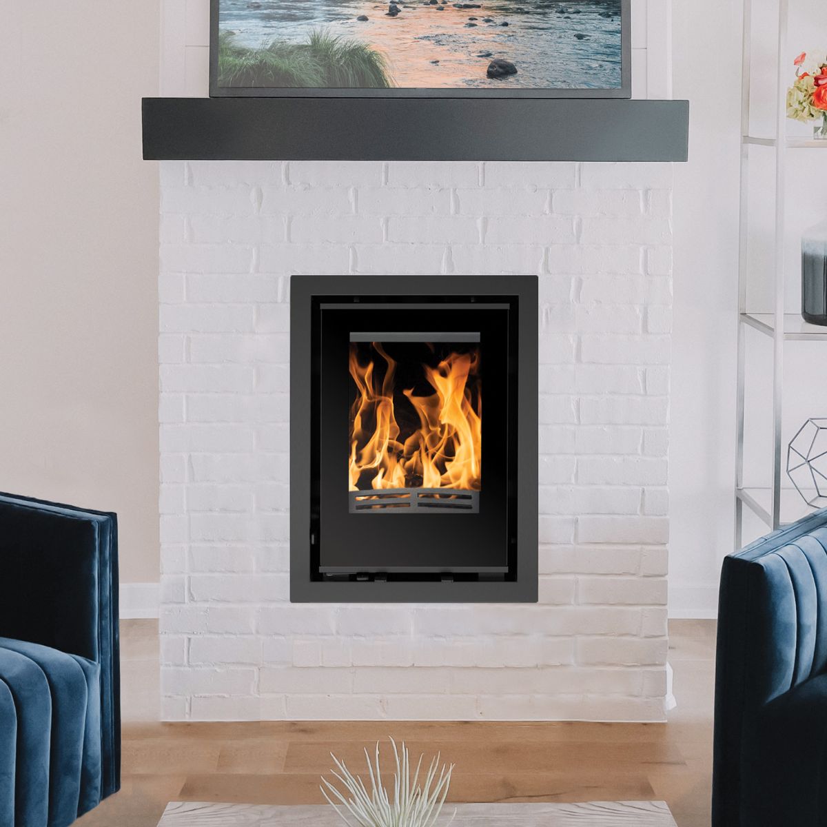 Bristol Stove Co Explorer 5iG inset multifuel stove with 4-sided frame installed in a fireplace