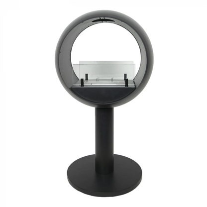 Modern black freestanding fireplace with glass front on a white background