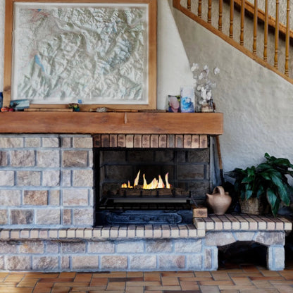 ScandiFlames Bioethanol Fire Grate XL – 80 cm in a brick fireplace with wooden mantel and decorative items in a home setting.