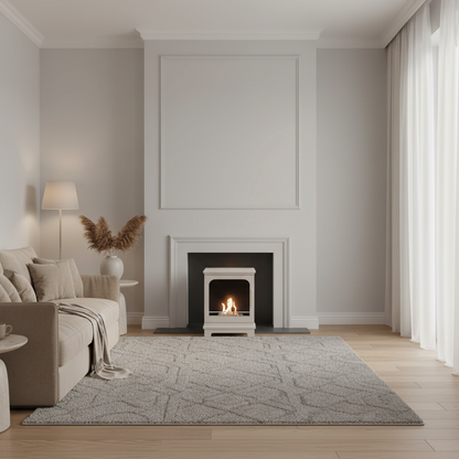 Oyster white freestanding fireplace with visible flames in  cream sitting room with sofa and accessories