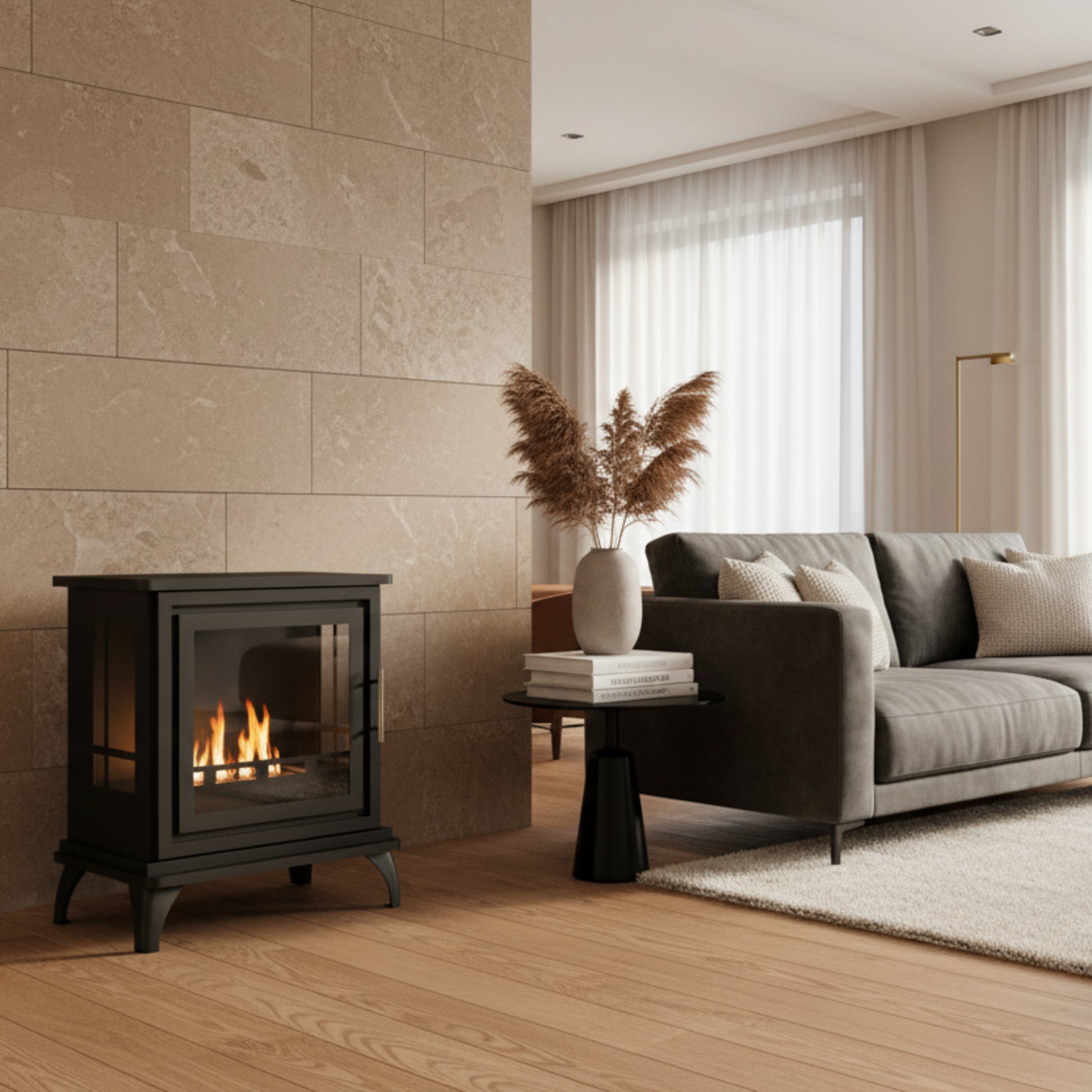 Black freestanding fireplace with visible flames on a white background
