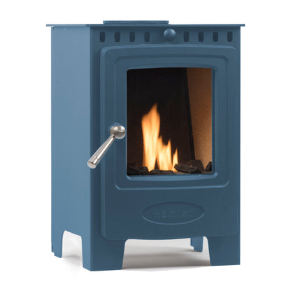 A blue cast iron wood-burning stove with a glass door showing a lit fire, featuring a silver metal handle and the brand name 'Hamlet' embossed on the lower front.