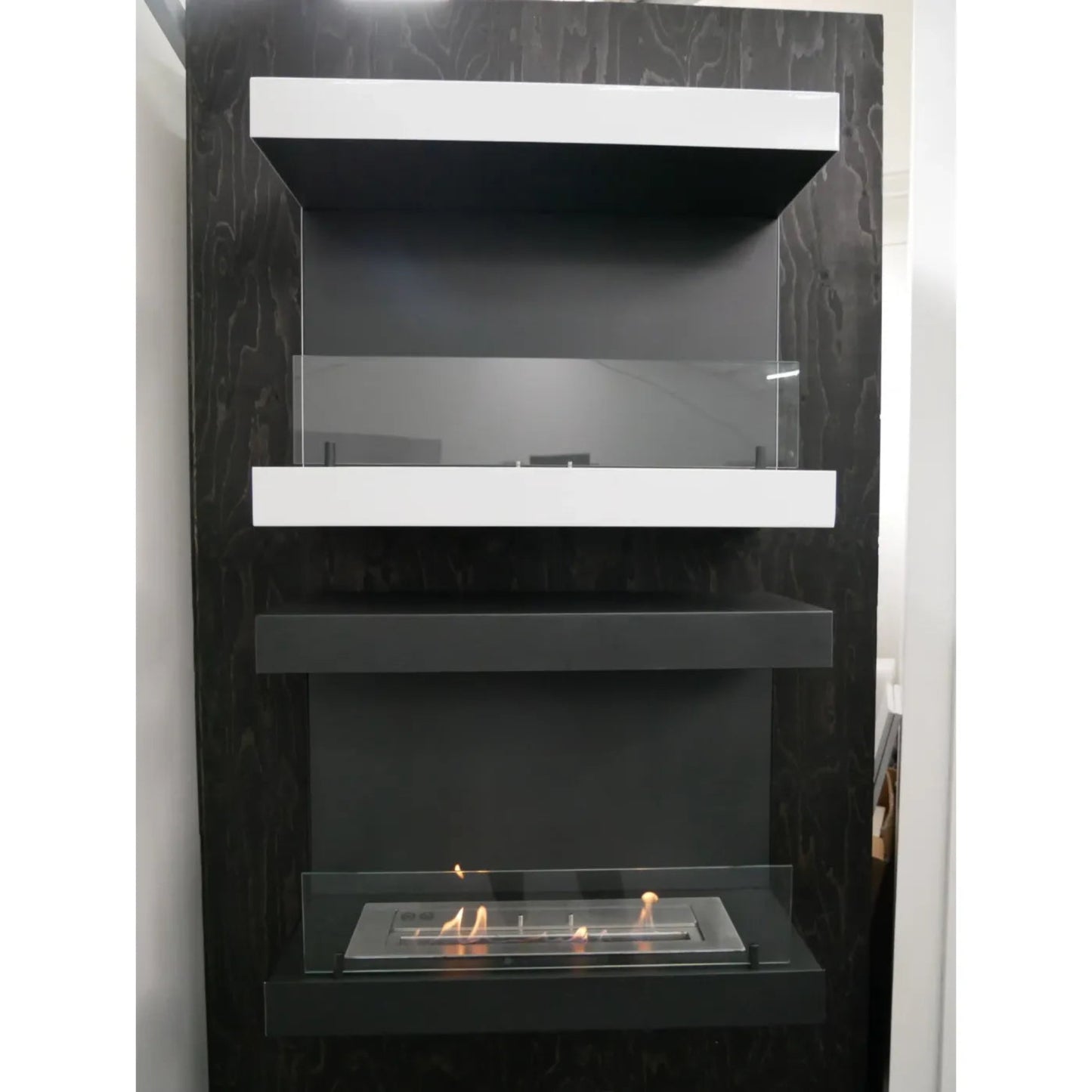 Modern black and white fireplace with glass front