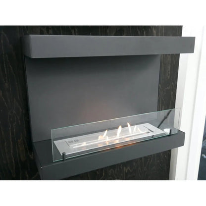 Modern ethanol fireplace with glass panel on a dark background